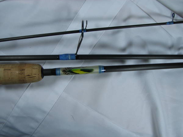 Travel rod with feather inlay
